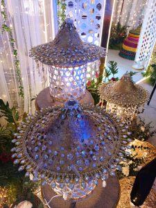 Three ornate conical lampshades crafted with intricate woven patterns and adorned with dangling crystal beads and decorative gems.