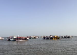 Passenger ferries moored in the Arabian Sea off the coast of Mumbai, India, near the Gateway of India.