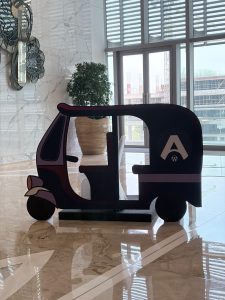 A decorative cutout or standee of an Indian auto rickshaw (or tuk-tuk) from WordCamp Asia 2026.
